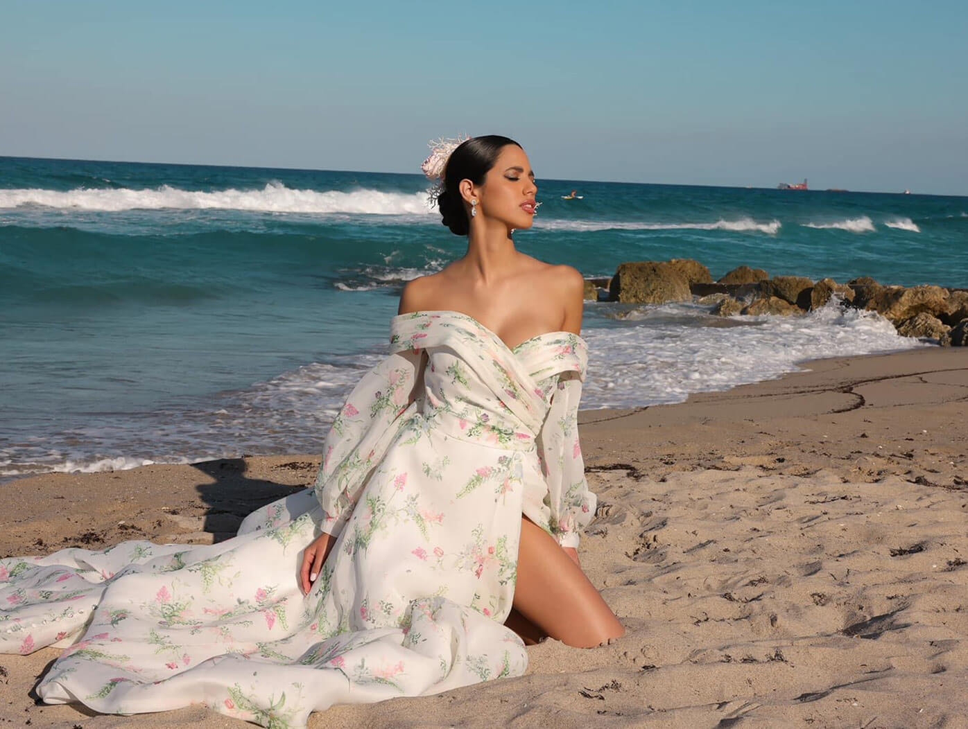 Model wearing a dress on the beach. Mobile image